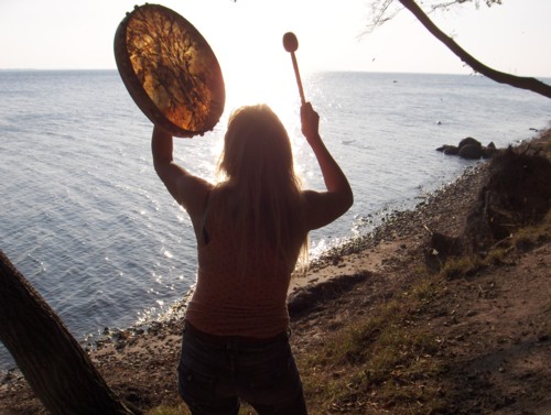 Susanne dancing meditating and drumming with her shamanic drum, calling upon spirit helpers and power animals